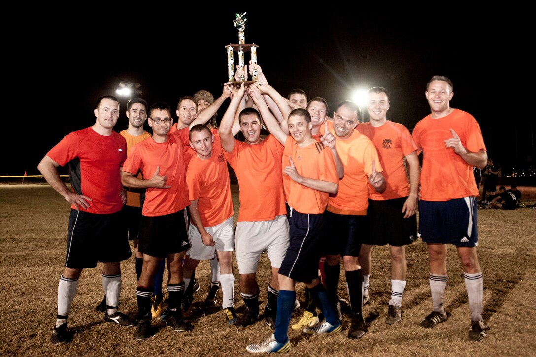 VANDENBERG AIR FORCE BASE, Calif. -- Members of the 14th Air Force soccer team pose for a victory group photo after defeating the 30th Security Forces Squadron’s soccer team 4-1 during a soccer championship here Thursday evening, June 6, 2013. (U.S. Air Force photo/Airman Yvonne Morales)