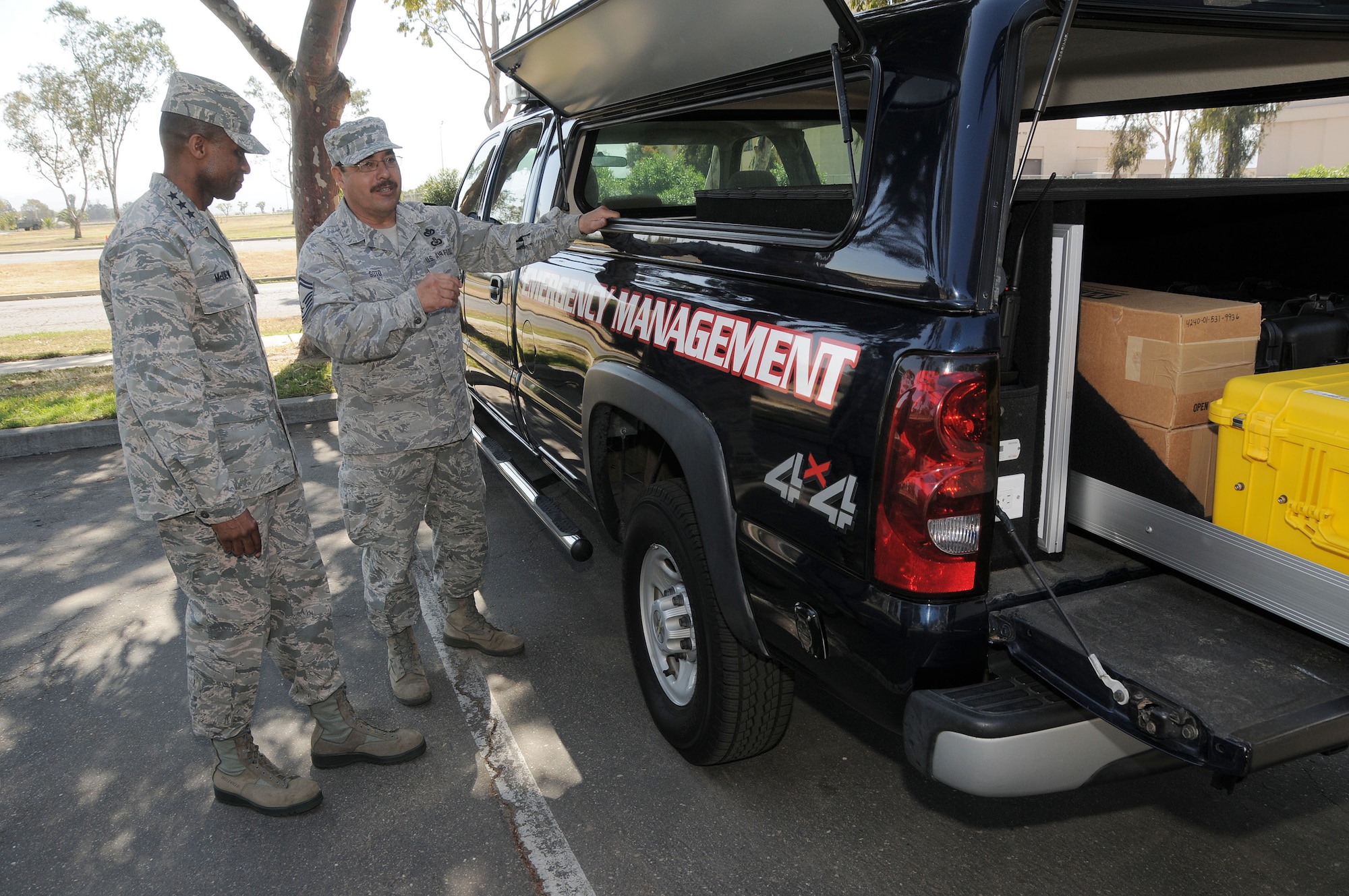 Lt. Gen. Darren McDew commander of the 18th Air Force is briefed by Senior Master Sgt. Oscar Soto of the 146th Emergency Management office, California Air National Guard,  on the capabilities of the crash response truck his office assembled on May 11, 2013. McDew?s visit was part of an overall familiarization tour of the missions and facilities at the 146th Airlift Wing, California Air National Guard, Port Hueneme, Ca. Air National Guard photo by Master Sgt. Dave Buttner