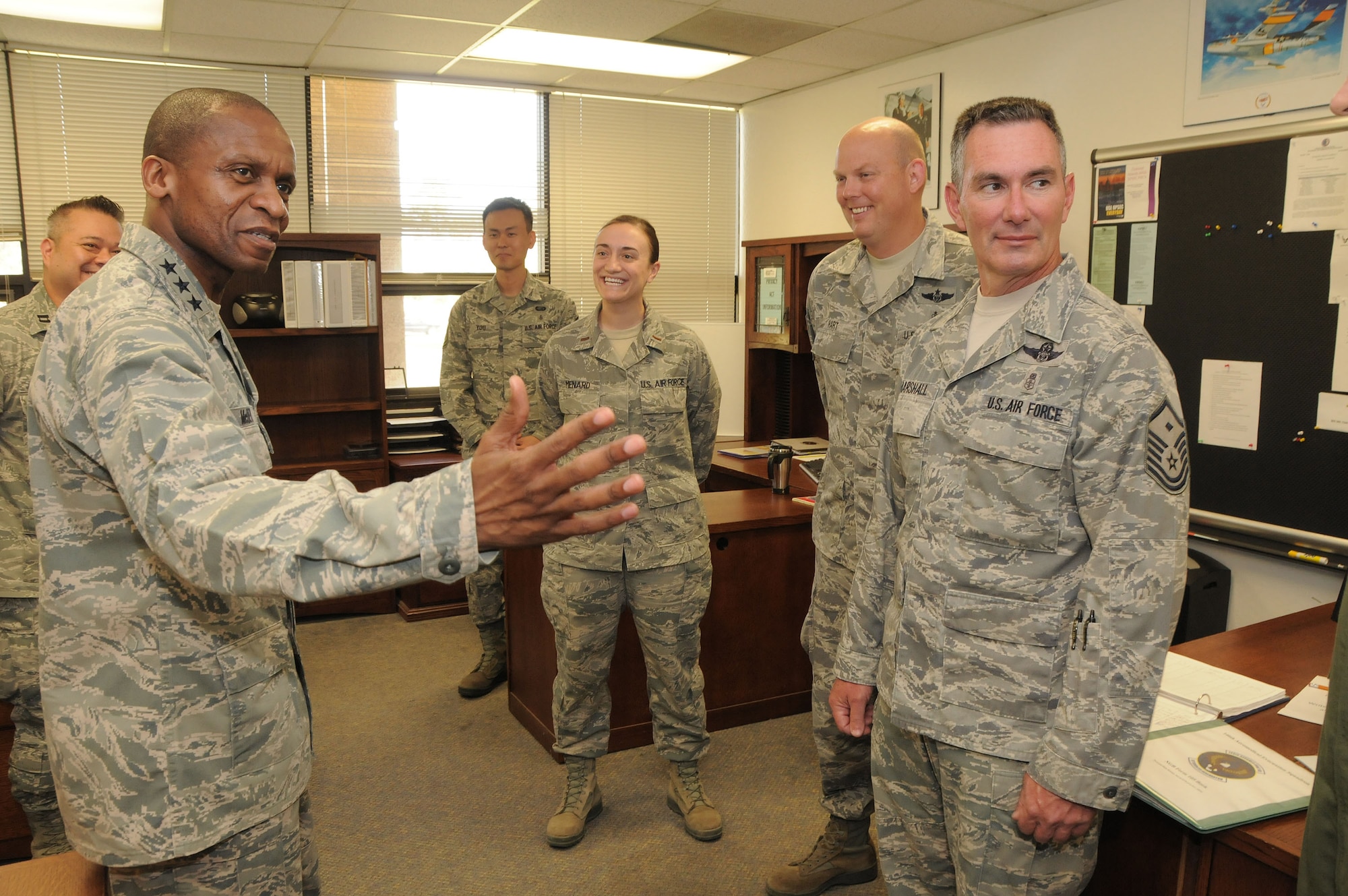 Lt. Gen. Darren McDew commander of the 18th Air Force speaks with, right to left, Master Sgt. Doug Marshall, Senior Master Sgt. Phil Hart, 2nd Lt. Lauren Menard and Master Sgt. Heejong You all members of the 146th Aeromedical Evacuation Squadron on May 11, 2013. McDew?s visit was part of an overall familiarization tour of the missions and facilities at the 146th Airlift Wing, California Air National Guard, Port Hueneme, Ca. Air National Guard photo by Master Sgt. Dave Buttner