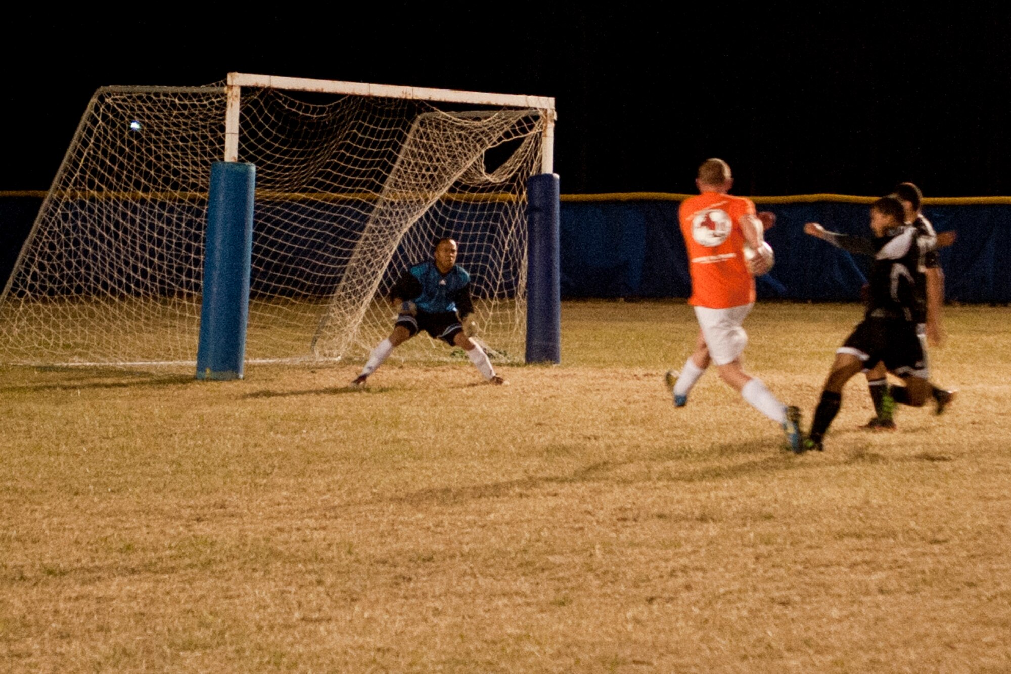 VANDENBERG AIR FORCE BASE, Calif. – Staff Sgt. Rian Hudson, 14th Air Force executive assistant, scores his second goal during a soccer championship here Thursday, June 6, 2013.  The 14th AF became the soccer champions after defeating the 30th SFS with a final score of 4-1 for the win.  (U.S. Air Force photo/Airman Yvonne Morales)