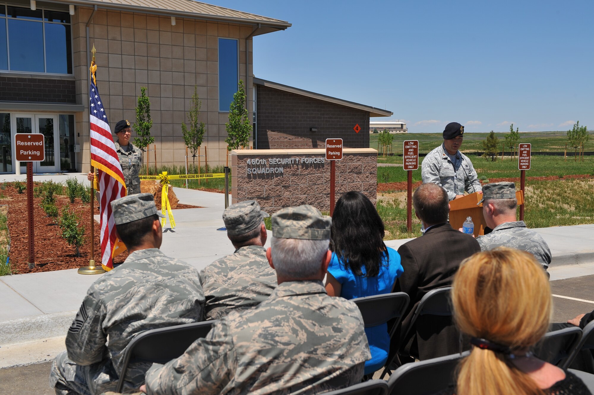 Maj. David Haigh, 460th Security Forces Squadron commander, challenges his Airmen to earn their new building at the 460th Security Forces Squadron ribbon-cutting ceremony June 6, 2013, on Buckley Air Force Base. The 460th SFS was previously housed in one of the oldest buildings on Buckley, and are now located in a state-of-the-art facility. (U.S. Air Force photo by Senior Airman Phillip Houk/Released)
