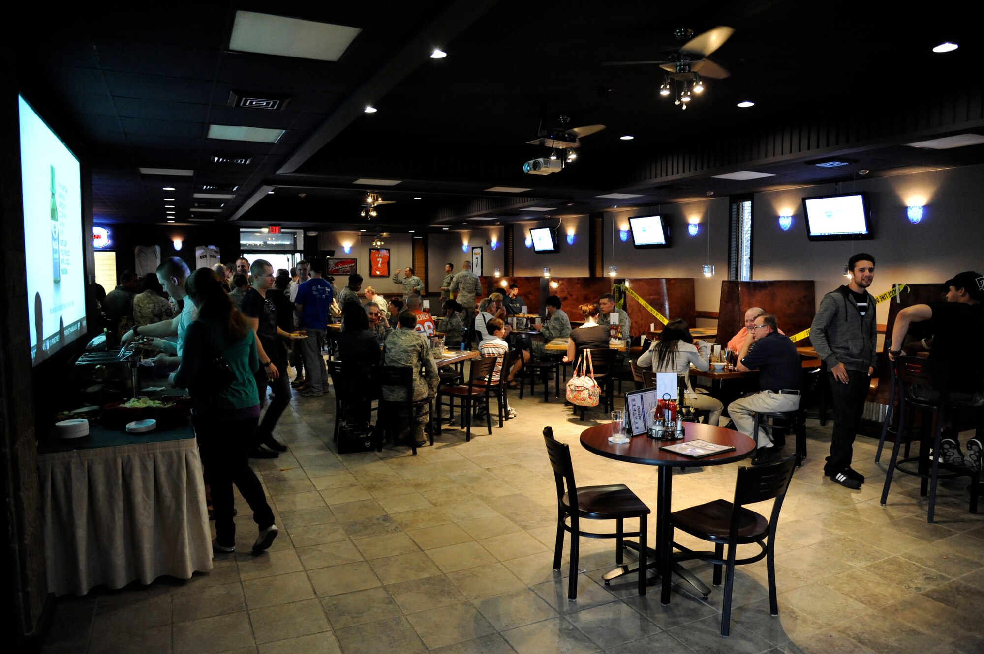 Patrons enjoy an evening at the Stripes enlisted club on Laughlin Air Force Base, Texas, Jan. 20, 2012. Air Force Club members receive a variety of benefits when attending Air Force clubs worldwide such as: free meals during club social hours, discounts, cash back, scholarship opportunities, and can take part in special member appreciation events. (U.S. Air Force photo/Airman 1st Class Nathan Maysonet)