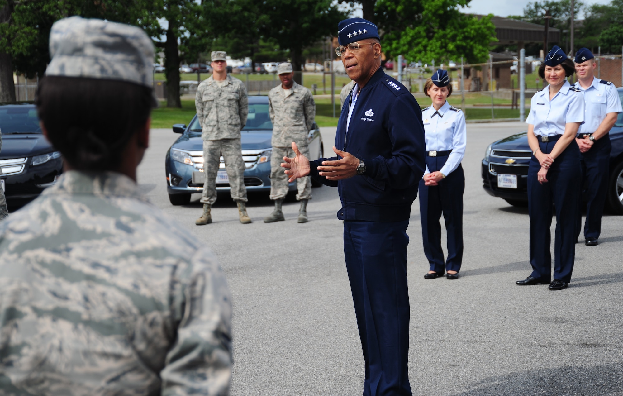 Vice Chief of Staff of the Air Force Gen. Larry Spencer speaks with Airmen from the 11th Logistics Readiness Squadron on Joint Base Andrews, Md., June 6, 2013.  Spencer coined four Airmen who collaborated on an idea to save the Air Force money. The Airmen found less expensive leases for distinguished visitor transport vehicles, which will save more than $10,000 per year. (U.S. Air Force photo/Airman 1st Class Erin O’Shea)