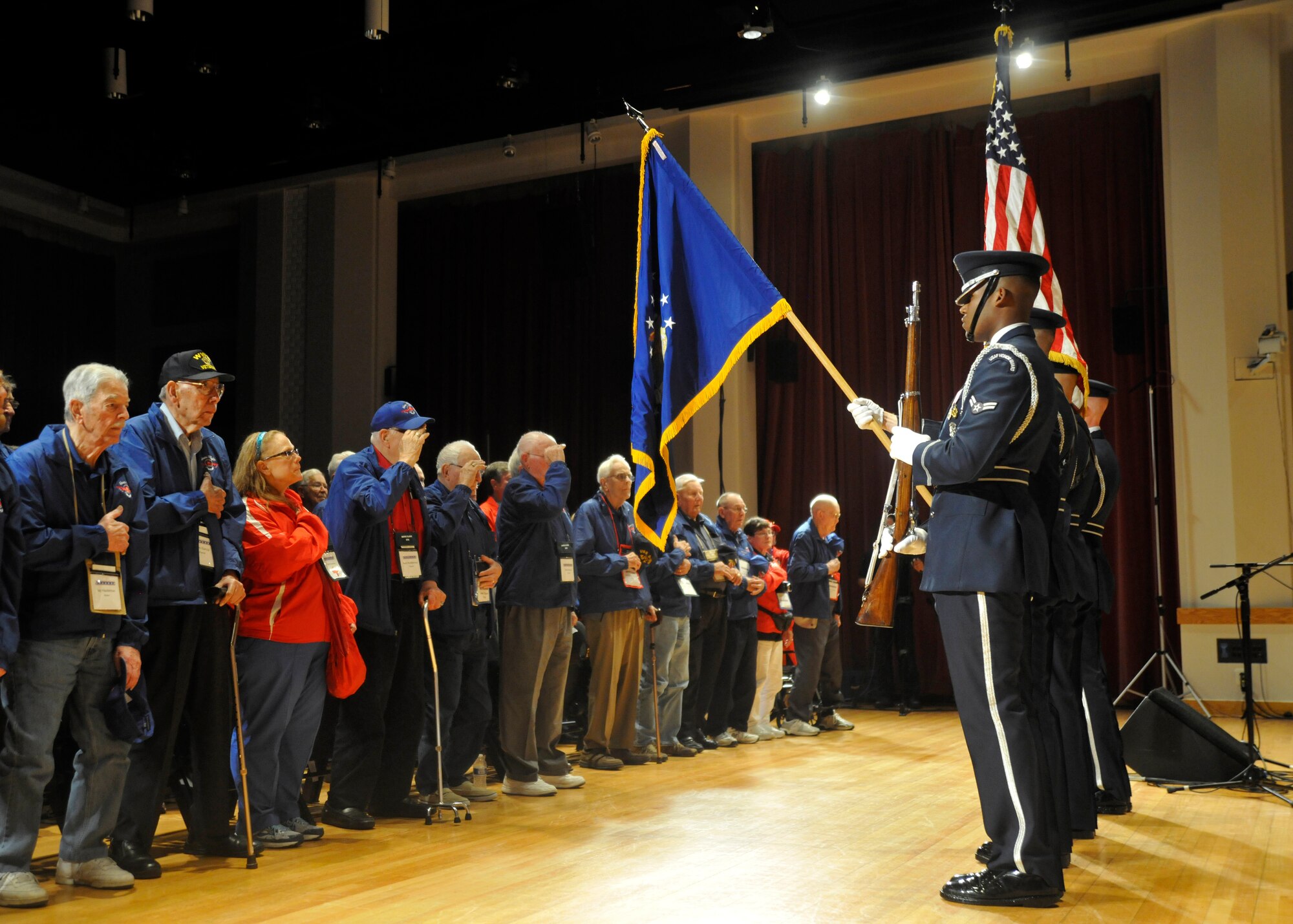 A U.S. Air Force Honor Guard color guard presents the colors to a group of World War II Honor Flight members at Joint Base Anacostia-Bolling April 20, 2013. The goal of the nation-wide Honor Flight program is to help every single veteran in America, willing and able of getting on a plane or a bus, to visit their respective national war memorial. (U.S. Air Force photo/Senior Airman Lindsey A. Porter)