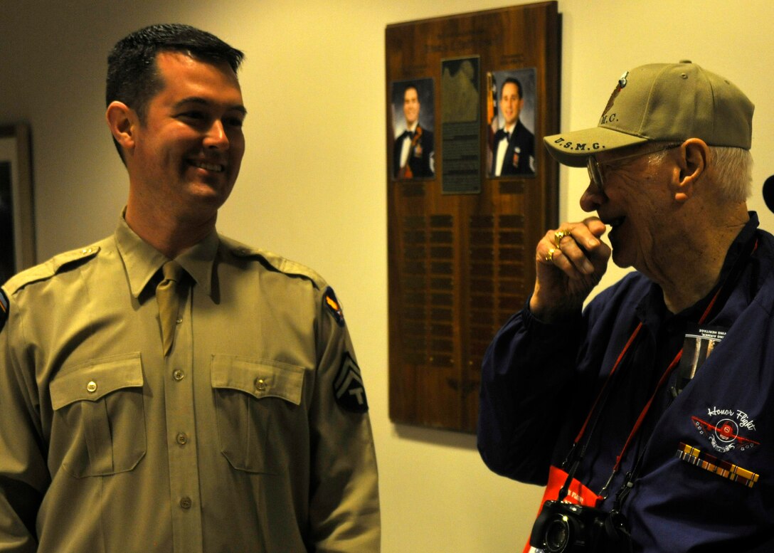 Master Sgt. Jeffrey Martin, Airmen of Note trombonist, and a visiting Dallas Honor Flight World War II veteran, talk before the Airmen of Note's performance at Joint Base Anacostia-Bolling April 20, 2013. The mission of the nation-wide Honor Flight program is to transport America's veterans to Washington, D.C. to visit those memorials dedicated to honor their service and sacrifices. (U.S. Air Force photo/Senior Airman Lindsey A. Porter)