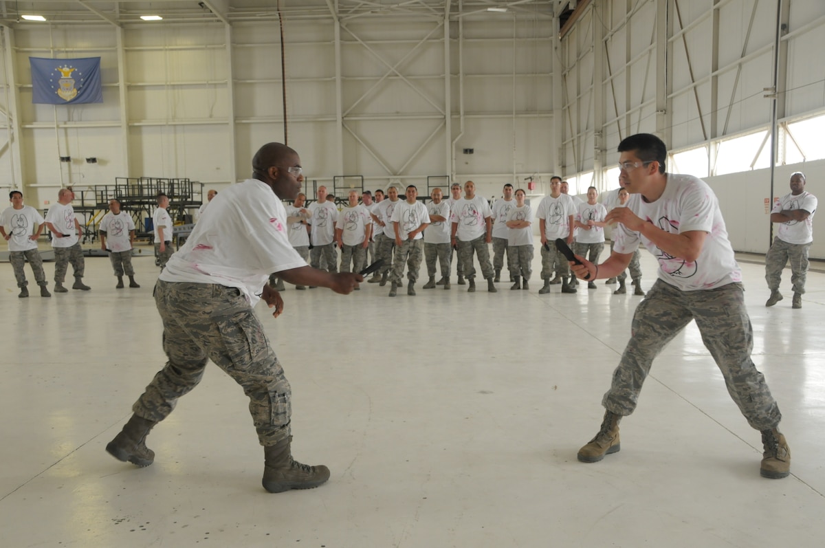 146th Airlift Wing Security Forces personnel train with weapons during a combat training course in the maintenance hangar at the 146th Airlift Wing ANGS, May 5, 2013. (Air National Guard photo by: Senior Airman Nicholas Carzis.) 