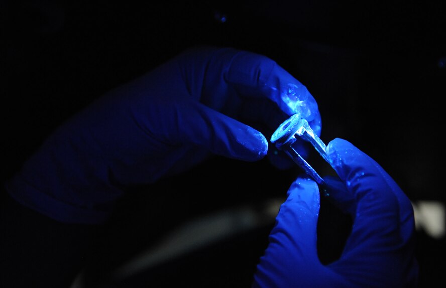 Airman 1st Class Leonard Avalos, 2nd Maintenance Squadron non-destructive inspection, checks for cracks on a piece of equipment on Barksdale Air Force Base, La., June 7, 2013. NDI Airmen look for cracks on parts using specialized equipment on the surface and subsurface level. (U.S. Air Force photo/Airman 1st Class Benjamin Gonsier)