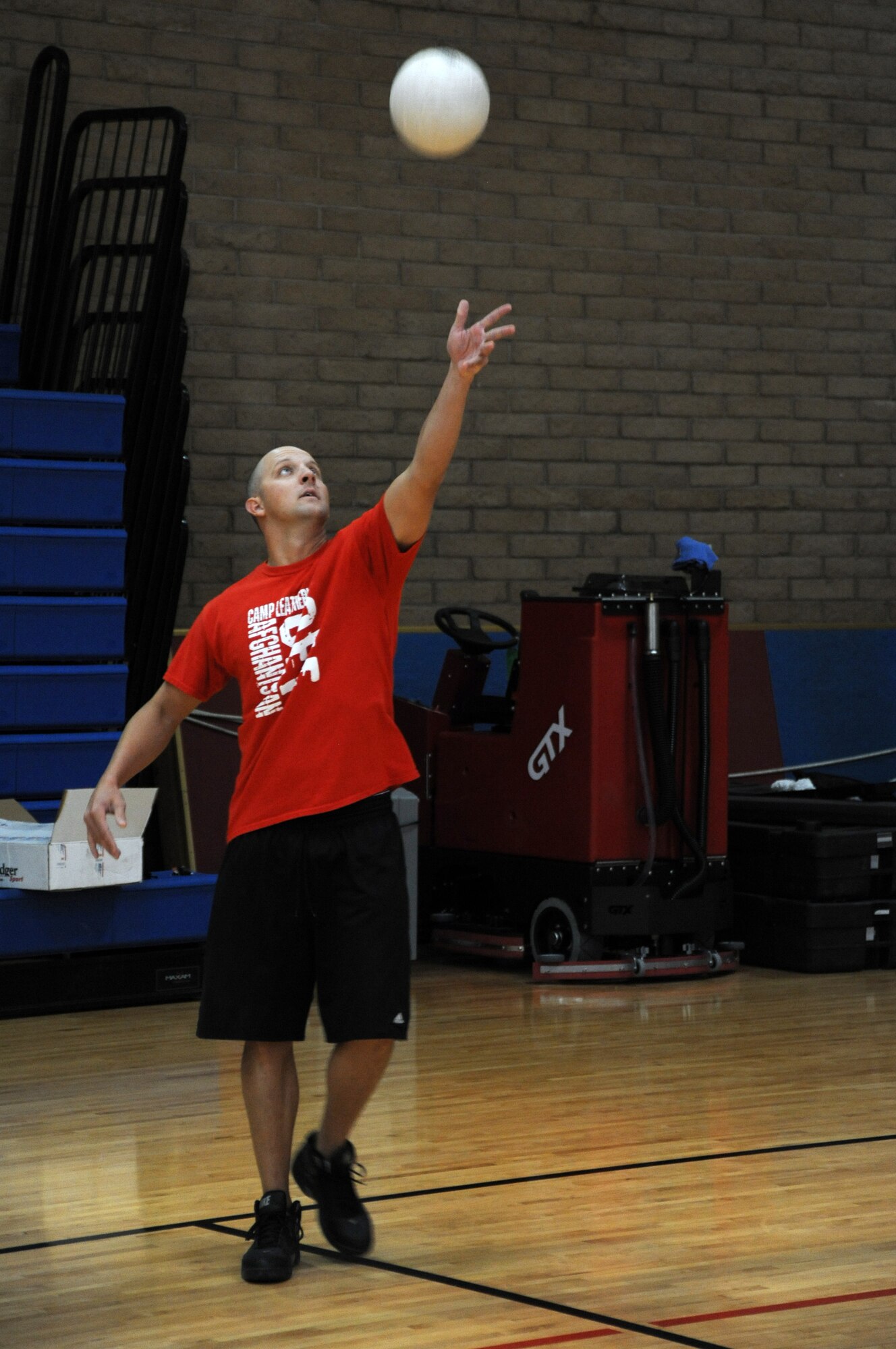 Staff Sgt. Johnathan Martin, 56th Medical Operations Squadron, serves the ball in a game against Luke Air Force Base chiefs in the Bryant Fitness Center.  The game helped to build a community relationship amongst members from the three enlisted force structure tiers.  (U.S. Air Force photo/Airman 1st Clas Pedro Mota)