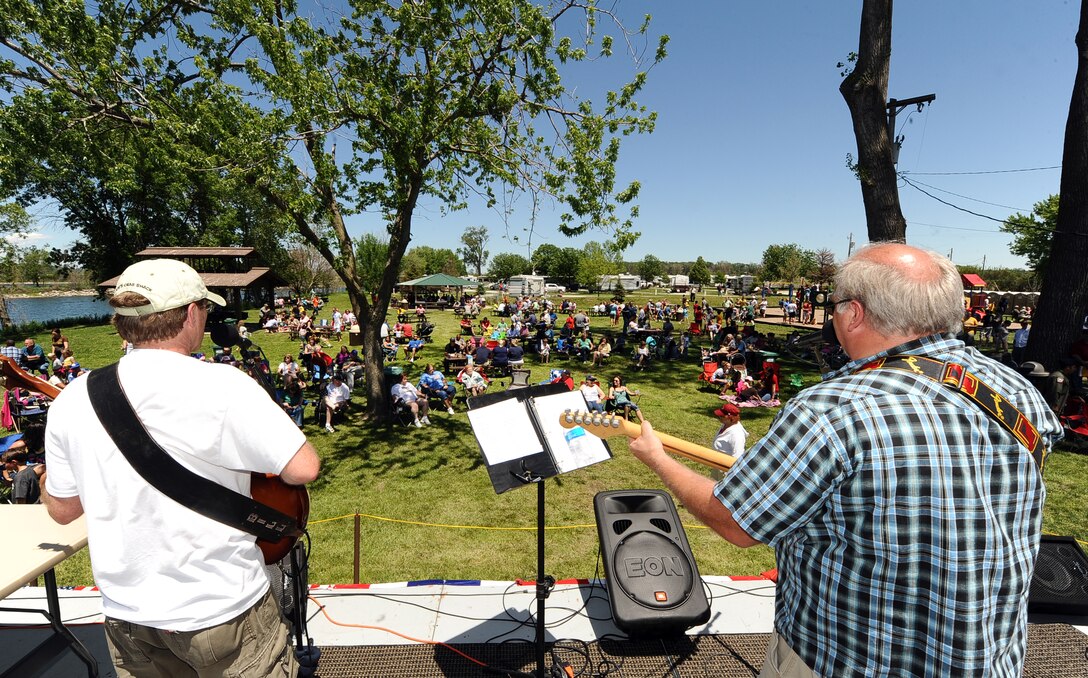 Rick Spurgin and the Out of the Fire Band, a Council Bluffs, Iowa based rock band, performs at the annual Offutt Appreciations Day Picnic hosted at the Base Lake on May 31, Offutt Air Force Base, Neb. The band played many classic rock tunes to a crowd of thousands of people. (U.S. Air Force photo by Josh Plueger/Released)