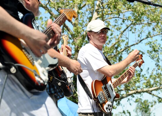 Rick Spurgin and the Out of the Fire Band, a Council Bluffs, Iowa, based rock band, performs at the annual Offutt Appreciations Day Picnic at the Base Lake on May 31, Offutt Air Force Base, Neb.  The band played many classic rock tunes to a crowd of thousands of people.  (U.S. Air Force photo by Josh Plueger/Released)
