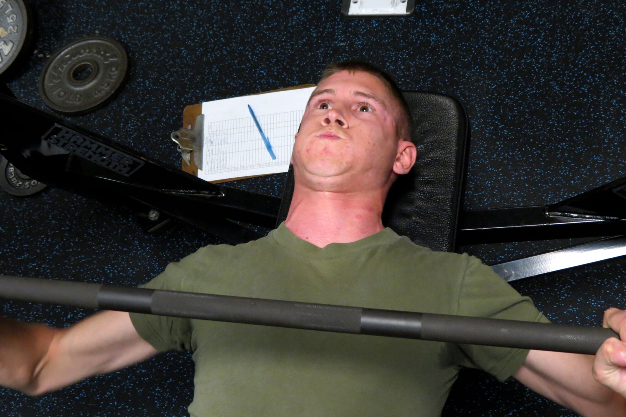 GRISSOM AIR RESERVE BASE, In. -- Mark Federspiel, Det. 1 Communications Company, Headquarters and Service Battalion, 4th Marine Logistics Group, strains as he participates in a bench press competition at the Grissom Fitness Center here May 13.  The fitness center held a variety of activities during May designed to  promote physical activity. (U.S. Air Force photo/Becca Hammer)