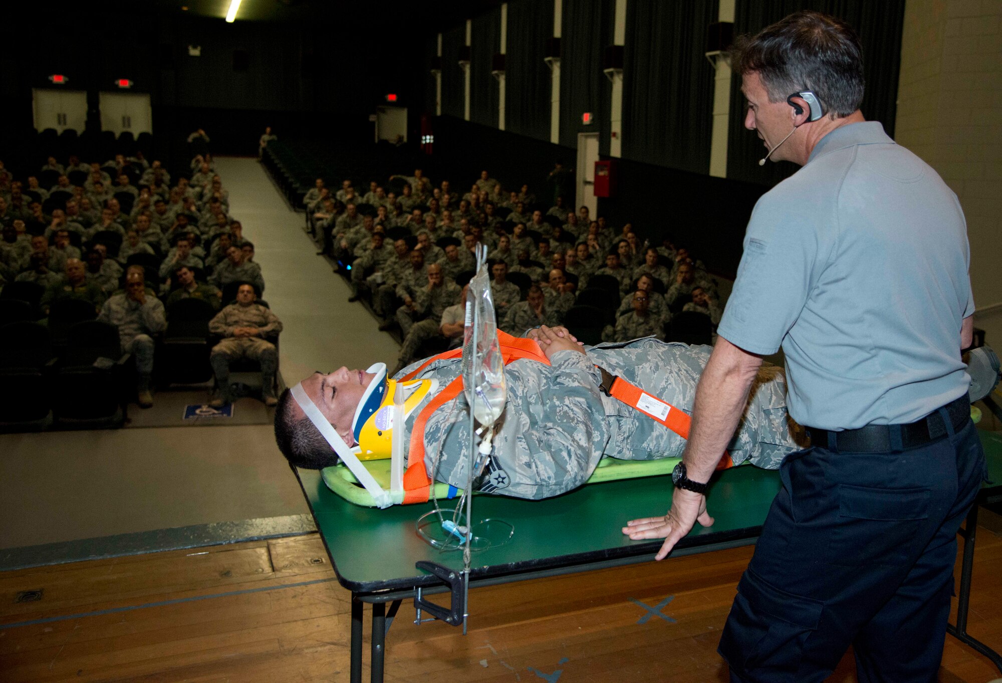 Vince Easevoli, Florida SAFE incorporated executive director, demonstrates on Senior Airman Freddy Toruno, 60th Diagnostics and Therapeutics Squadron, the steps first responders take when arriving on scene to an accident. Easevoli is part of Stay Alive From Education, an organization created by firefighters and paramedics in Florida, dedicated to reducing injuries and fatalities due to drinking and driving and non-compliance with seatbelt use. (U.S. Air Force photo/Airman 1st Class Nicole Leidholm)