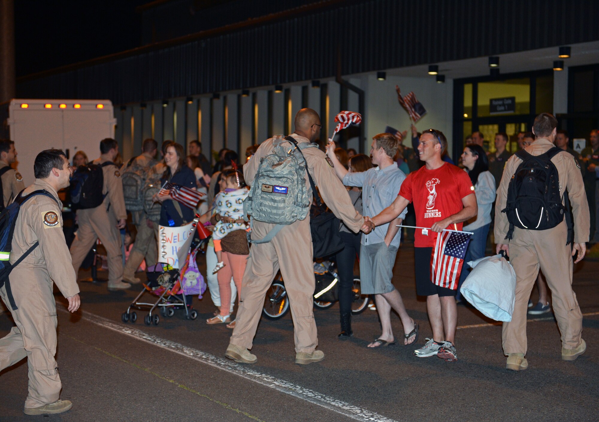 Family and friends greet Airmen from the 4th Airlift Squadron home June 6, 2013 at Joint Base Lewis-McChord, Wash. The 4th AS was deployed as the 817th Expeditionary Airlift Squadron, operating out of two bases in and around Southwest Asia. (U.S. Air Force photo/Staff Sgt. Jason Truskowski)