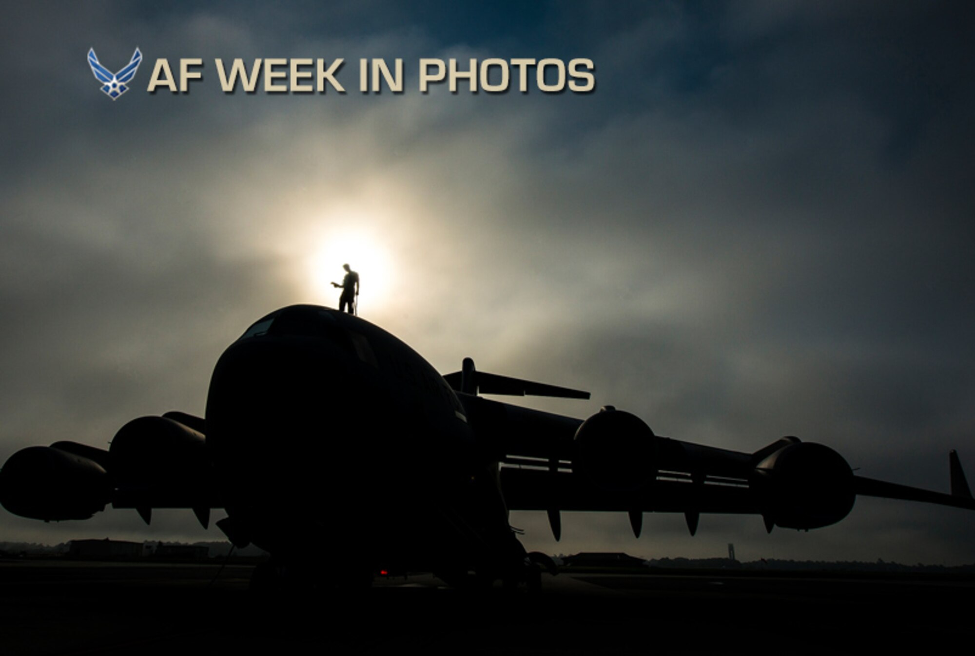 Tech. Sgt. Andrew Gravett walks along the top of a C-17 Globemaster III while wearing a safety harness as he does a routine maintenance check of the aircraft June 4, 2013, at Joint Base Charleston, S.C. The first C-17 to enter the Air Force’s inventory arrived at Charleston Air Force Base in June 1993. The C-17 is capable of rapid strategic delivery of troops and all types of cargo to main operating bases or directly to forward bases in the deployment area. Gravett is a crew chief assigned to the 437th Aircraft Maintenance Squadron. (U.S. Air Force photo/Senior Airman Dennis Sloan)