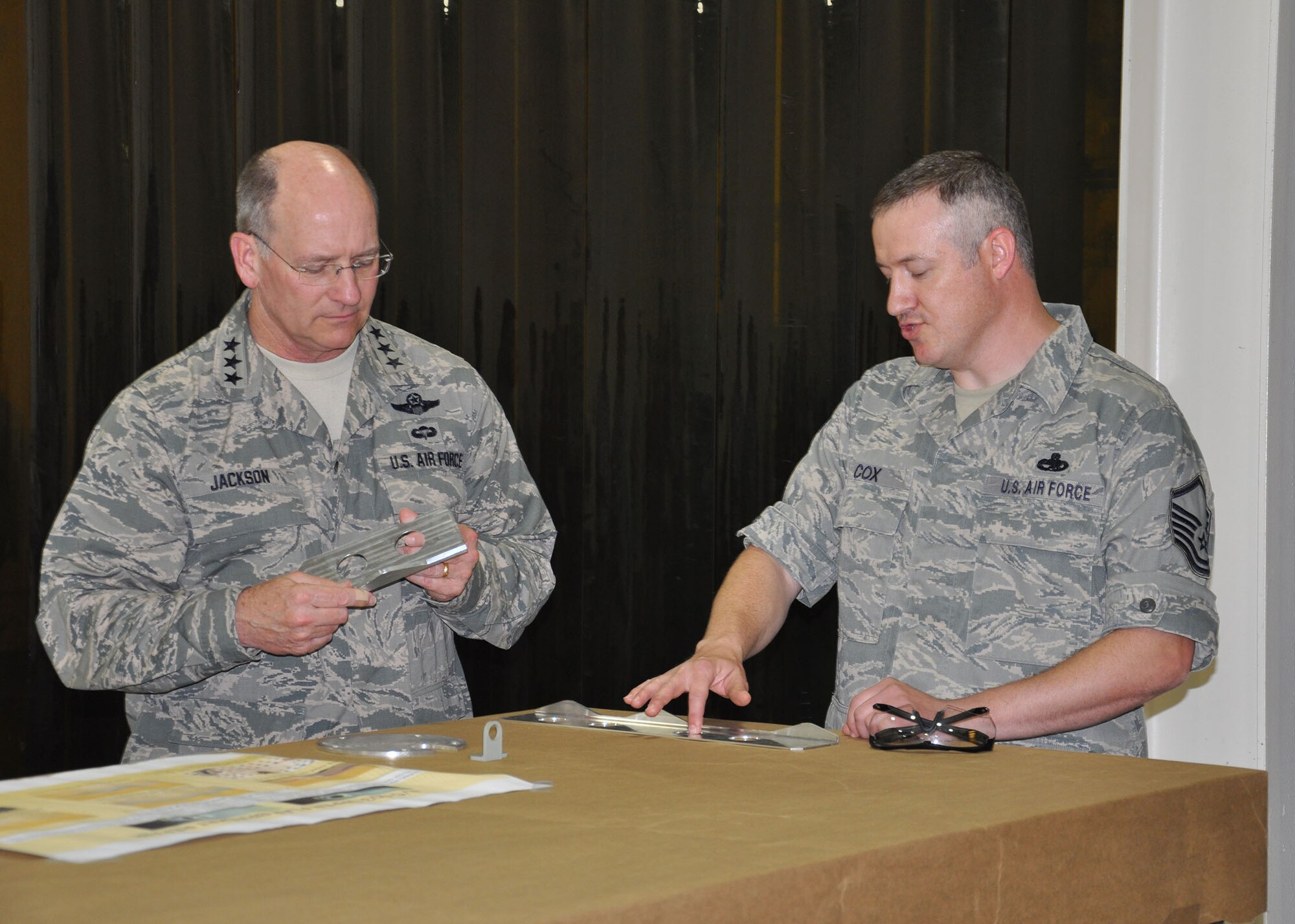 WRIGHT-PATTERSON AIR FORCE BASE, Ohio –Master Sgt. Jason Cox, 445th Maintenance Squadron metals technology craftsman, shows Lt. Gen. James F. Jackson, commander, Air Force Reserve Command, several types of C-17 Globemaster III aircraft components that the squadron's Metals Technology Section manufactures in house for aircraft sustainment during the general’s visit to the 445th Maintenance Squadron’s Fabrication Flight June 6, 2013.  During his visit to the wing, the general toured various 445th Airlift Wing units and held a town hall meeting for wing reservists and civilians. (U.S. Air Force photo/Stacy Vaughn)