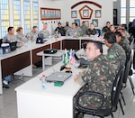 Delegates from U.S. Army South and the Brazilian army discuss Agreed to Actions under consideration for execution in 2014 during the 29th annual bilateral staff talks in Manaus, Brazil, May 21.