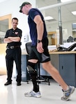 Army 1st Lt. Matthew Anderson, an infantry platoon leader with an injured lower leg, tries out the fit of an adjusted Intrepid Dynamic Exoskeletal Orthosis, or IDEO, as Ryan Blanck, the device’s creator, watches him walk at the Center for the Intrepid at Joint Base San Antonio-Fort Sam Houston. (Photo by Linda Hosek)