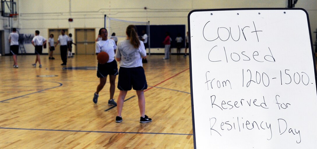 Airmen play basketball and volleyball during the 11th Wing Resiliency Day at the West Fitness Center at Joint Base Andrews, Md., June 5, 2013.  The 11th Wing took a pause in their day to day mission in order to reinforce the wingman concept, focus on Airman and the wellness of their units. (U.S. Air Force photo/Airman 1st Class Nesha Humes)(Released)