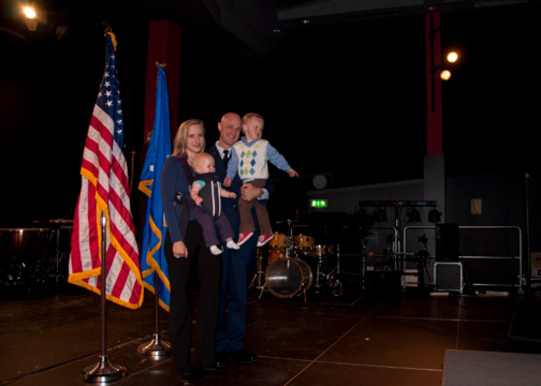 Staff Sergeant Ken Jones celebrates his recent promotion with his family.  SSgt Jones was the recipient of the Leadership Award and the Distinguished Graduate Award from Ramstein Airman Leadership School, Class 2013-4.  (Air Force photo by SSgt Jon Friedman)         