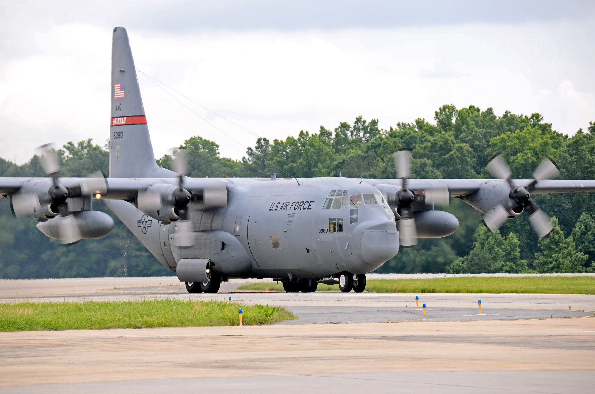 A C-130 Hercules from the 165th Airlift Wing of the Georgia Air Guard at Savannah taxis in from the runway at Dobbins Air Reserve Base, Ga., Jun 6. Three aircraft evacuated from Savannah to Dobbins to avoid the path of tropical storm Andrea as it made its way across Florida and up the east coast. (U.S. Air Force photo/Brad Fallin)