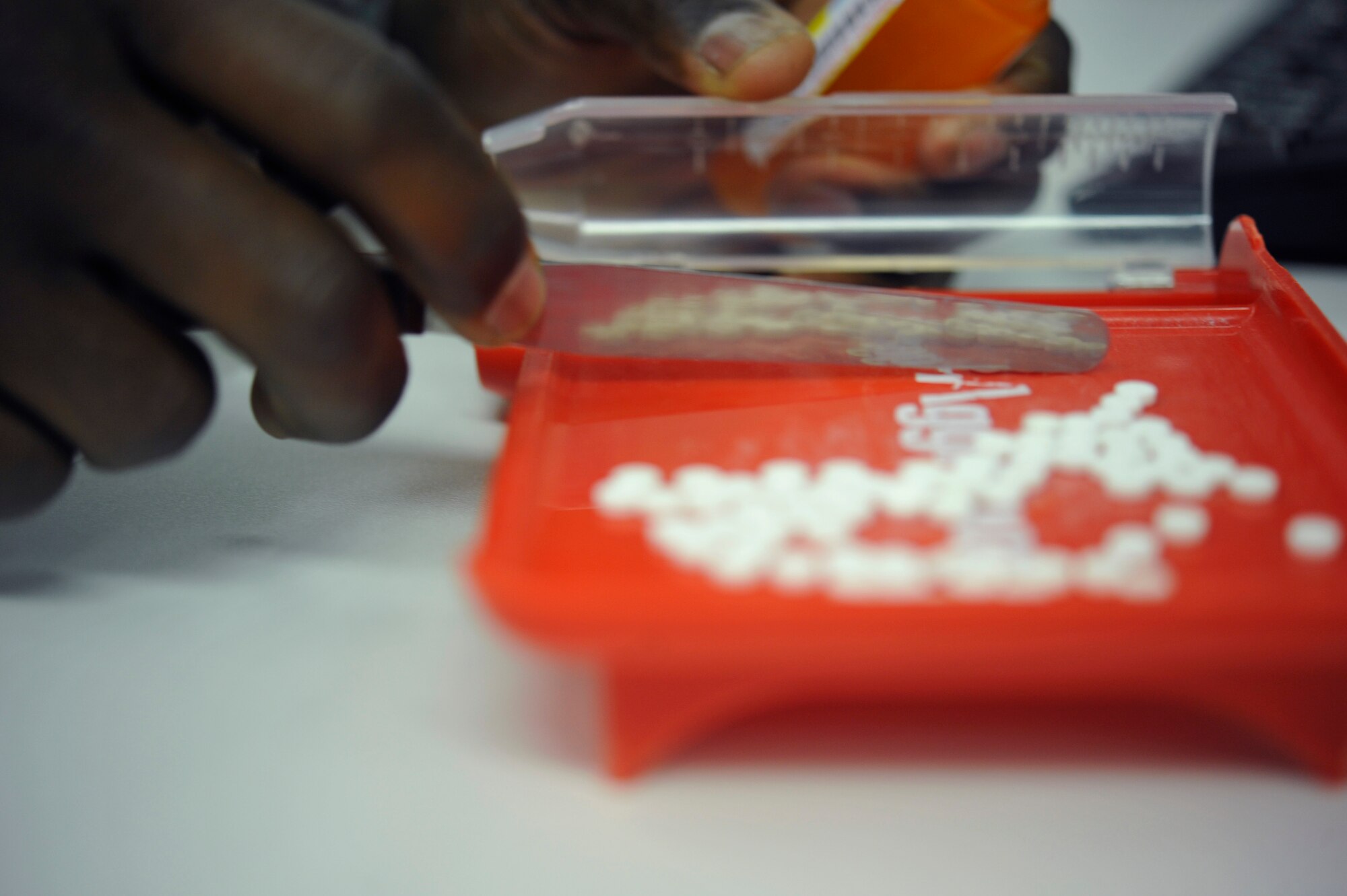 Tech Sgt. Elroy Plummer, 86th Medical Group pharmacy technician, triple counts controlled medication to ensure an accurate prescription amount, May 31, 2013, Ramstein Air Base, Germany. The 86th MDG pharmacy maintains readiness by providing the KMC with daily pharmaceutical needs and customer service. (U.S. Air Force photo/Senior Airman Aaron-Forrest Wainwright)