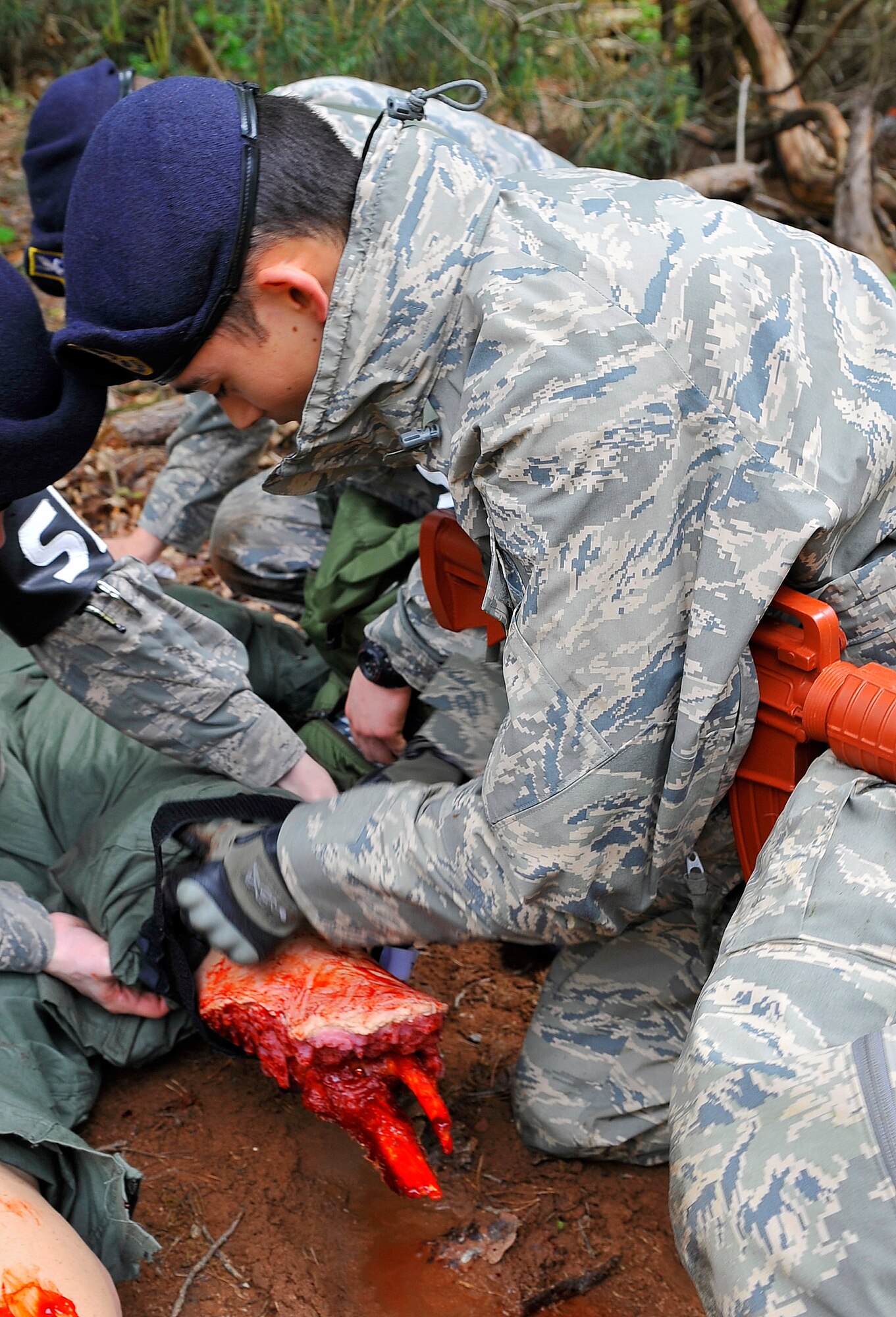 Members of the 569th U.S. Forces Police Squadron and 86th Medical Group practice life-saving techniques during a training exercise, May 30, 2013, Ramstein Air Base, Germany. (U.S. Air Force photo/Airman 1st Class Trevor Rhynes)