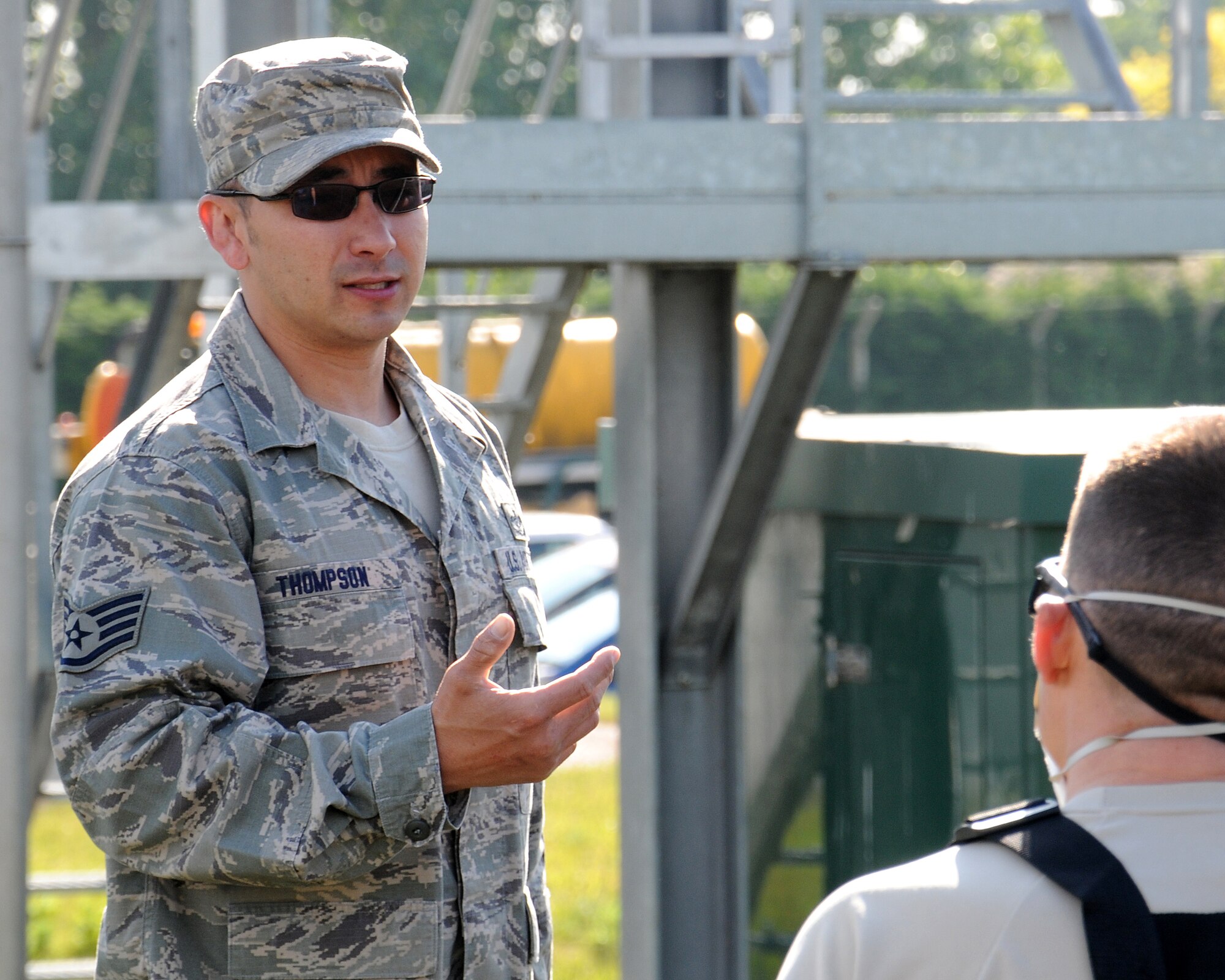From left, Staff Sgt. David Thompson, 100th Civil Engineer Squadron Water and Wastewater Plant operator from Emmett, Idaho, debriefs Chief Master Sgt. Tracy Jones, 100th Air Refueling Wing command chief, on his skills as a water plant operator following a training exercise June 6, 2013, at RAF Mildenhall, England. Water plant personnel showed Jones how they do their job as part of a “dirty jobs” program. (U.S. Air Force photo by Gina Randall/Released)