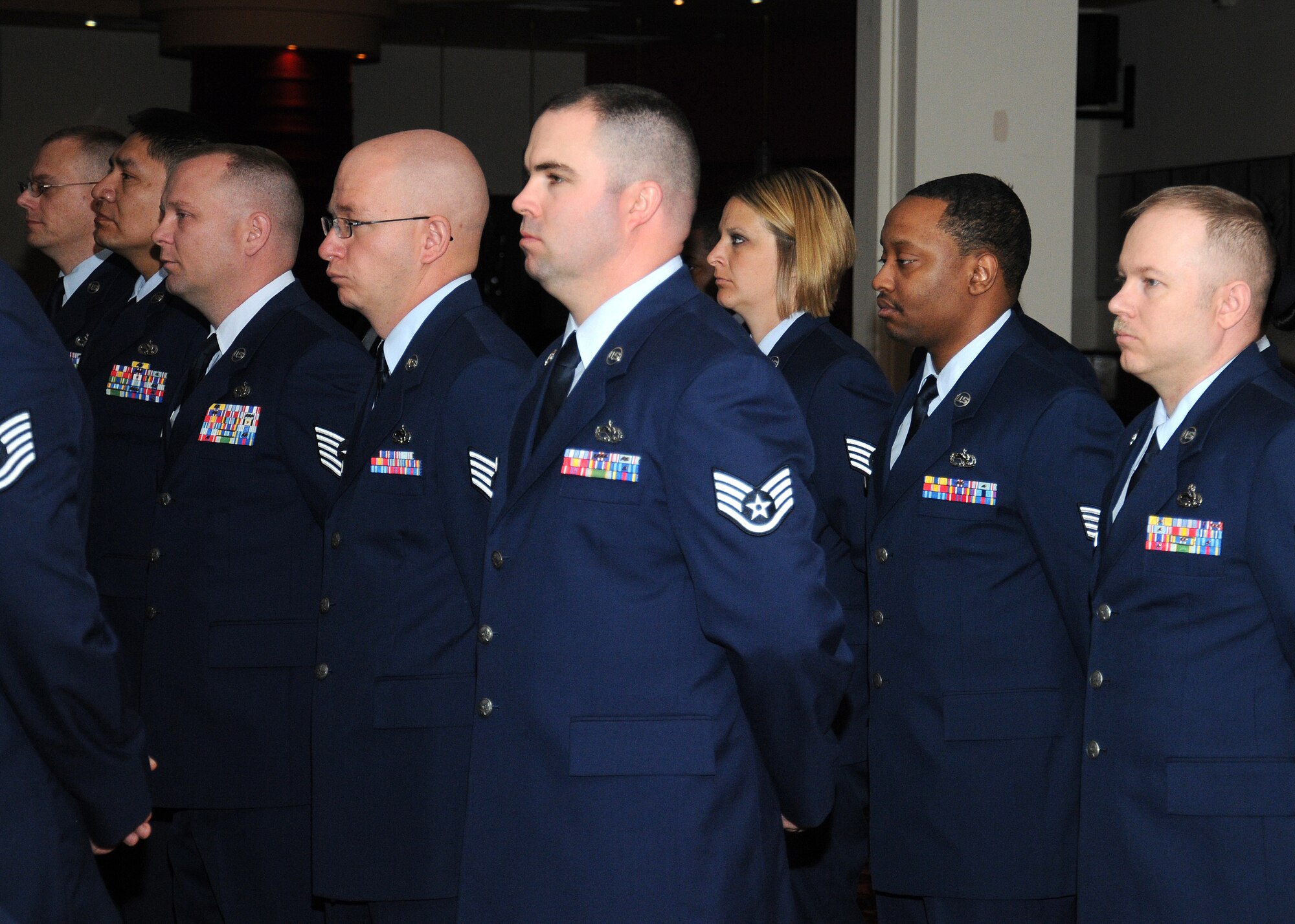 Service members from the 100th Maintenance Operations Squadron stand in formation during an inactivation ceremony June 3, 2013, at RAF Mildenhall, England. The 100th Logistics Readiness Squadron was activated Feb. 1, 1992, at RAF Mildenhall. Ten years later the squadron was re-designed as the 100th MOS. (U.S. Air Force photo by Gina Randall/Released)
