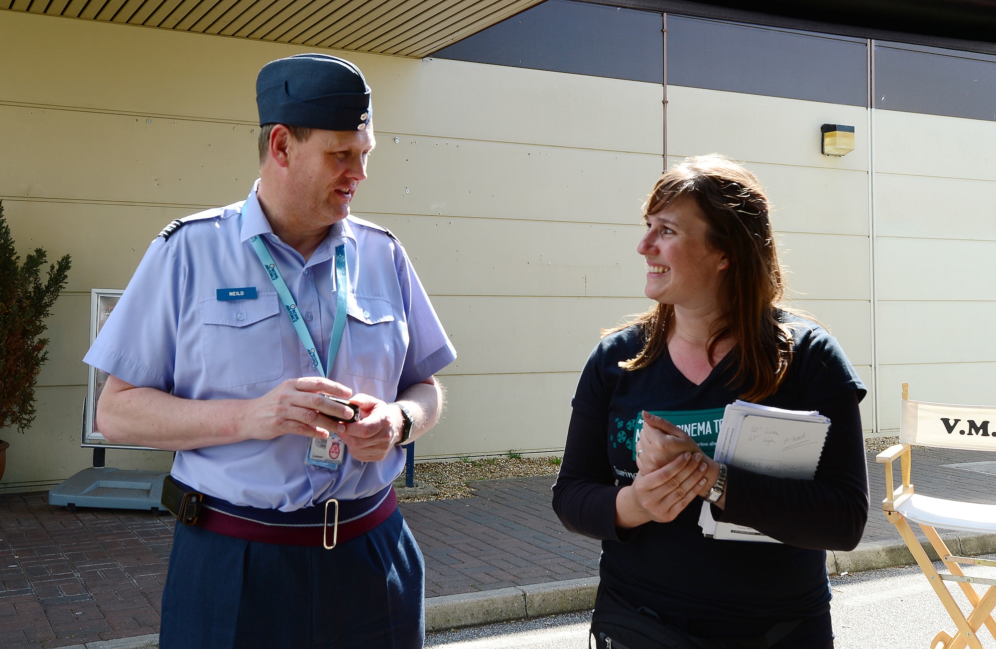 ROYAL AIR FORCE LAKENHEATH, England – Royal Air Force Sqn. Ldr. Jeremy Neild, RAF Lakenheath commander, speaks with Lindsey Roffe, Digital Project communications manager of Norwich Heritage Economic and Regeneration Trust, at the Base Exchange June 5, 2013. Roffe and her crew brought the 1967 mobile cinema bus to give the base populace an opportunity to see East Anglia footage from the 1940s shot by U.S. Army Air Force Airmen. (U.S. Air Force photo by Senior Airman Tiffany M. Grigg) 