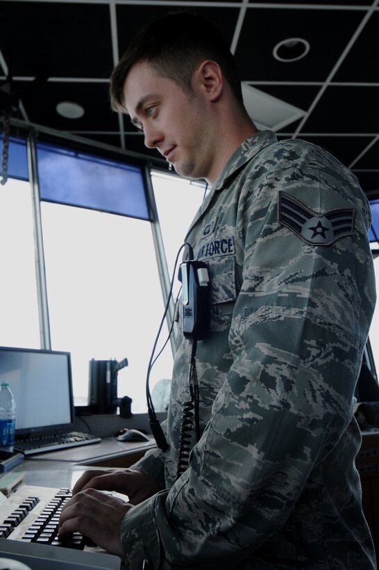 Senior Airman Michael-Paul Kendall, 36th Operations Support Squadron air traffic controller, inputs a flight plan for an aircraft May 30, 2013, on Andersen Air Force Base, Guam. The air traffic controllers use the flight plan to track the movement of aircraft from each checkpoint to remain aware of aircraft locations. (U.S. Air Force photo by Airman 1st Class Emily Bradley/Released)
