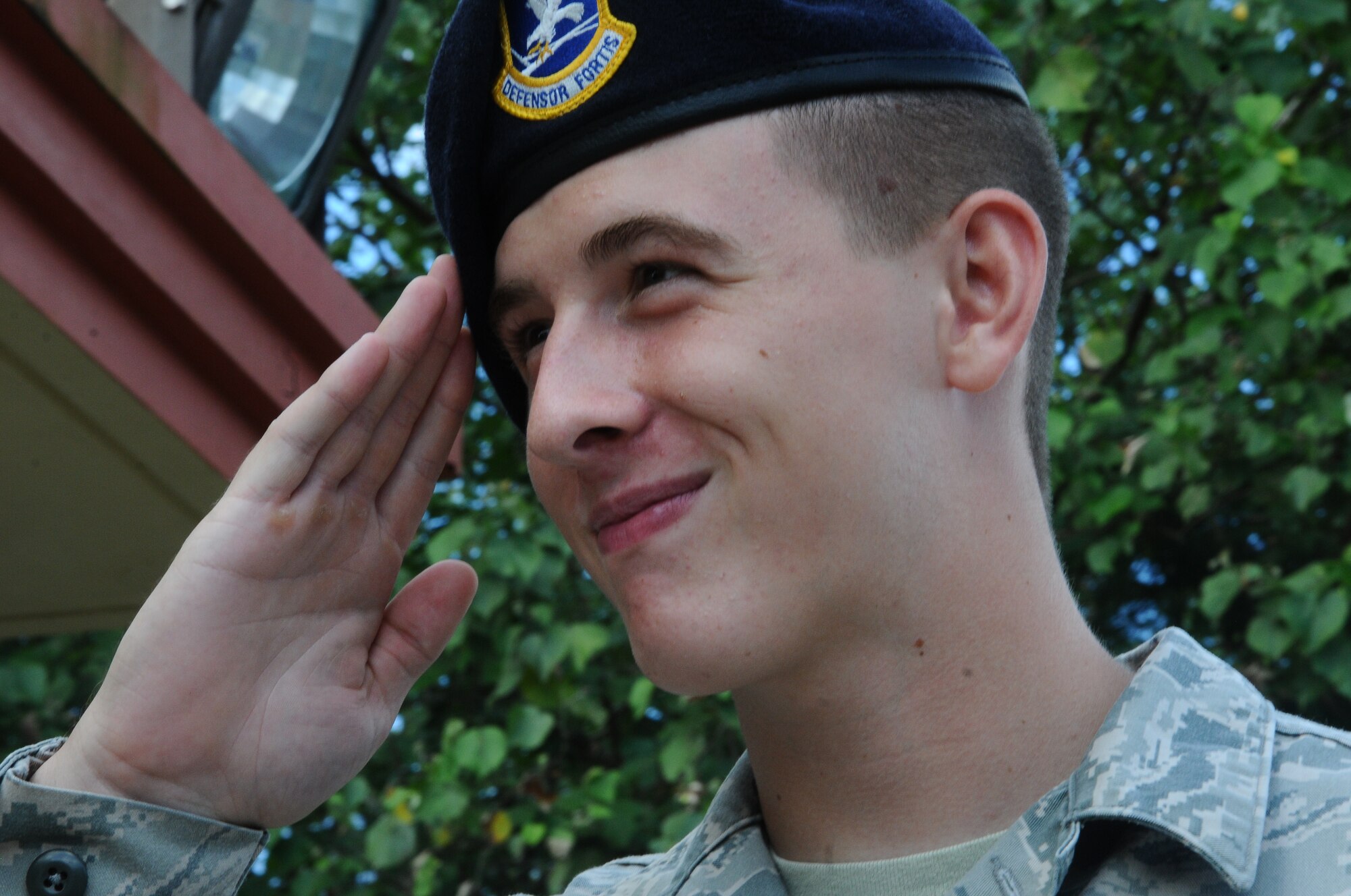 Airman 1st Class Tyler Kidder, 36th Security Forces Squadron designated gate guard, renders proper customs and courtesies to an officer in passing May 29, 2013, on Andersen Air Force Base, Guam. The DGGs reflect the highest standards of military bearing and the profession of arms. (U.S. Air Force photo by Airman 1st Class Emily A. Bradley/Released)