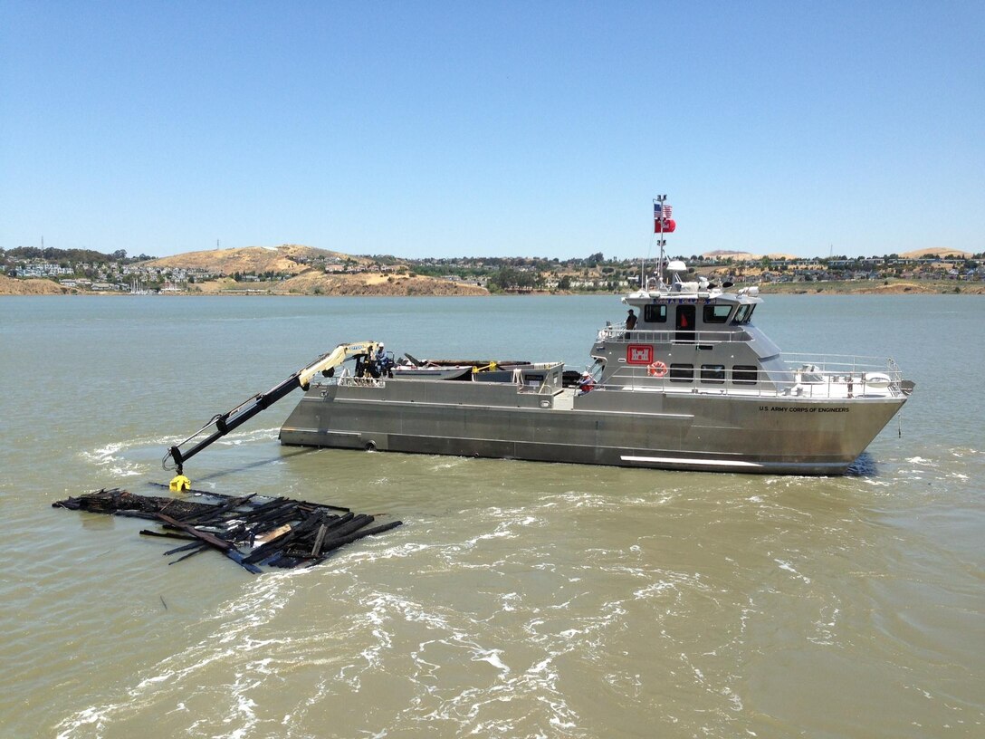 Crewmembers from the John A.B. Dillard picking up and removing debris in the S.F. Bay.