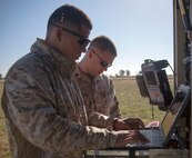 130520-M-WB921-027 MORON DE LA FRONTERA, Spain -- Corporal Cristobal Gomez, front, a Special-Purpose Marine Air-Ground Task Force Crisis Response satellite technician and San Antonio native, and Sgt. Justin Hofelich, SP-MAGTF Crisis Response satellite communication chief and Madison, Ind. native, prepare a Very Small-Aperture Terminal Large Satellite aboard Moron Air Base, May 20. "Satellite communications allow reliable and efficient communication support across the task force's area of responsibility, wherever we asked to go," said Capt. John Schreiner, the communications officer for SP-MAGTF Crisis Response and Sandusky, Ohio native. The SP-MAGTF Crisis Response is a rotational force of approximately 500 Marines and sailors sourced from a variety of Marine Corps units to include II Marine Expeditionary Force, Camp Lejeune, N.C., according to the force's requirement and their mission of being task organized, rapid-deployment force within the African regional reach to respond to crisis and defend U.S. security interests. (Marine Corps photo by Lance Cpl. Caleb McDonald/Not Released)