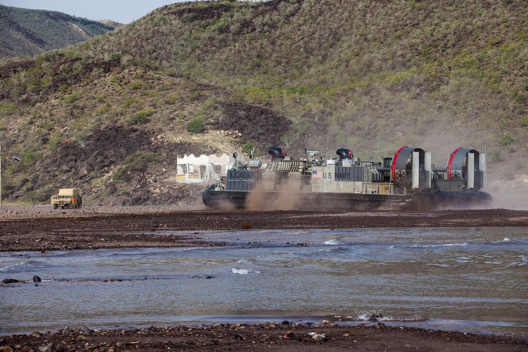 A landing craft, air cushion vessel assigned to the USS Kearsarge (LHD 3), transports light armored vehicles and Humvees assigned to the 26th Marine Expeditionary Unit (MEU), to Arta Beach in Djibouti, Africa, May 27, 2013. The 26th MEU is a Marine Air-Ground Task Force forward-deployed to the U.S. 5th Fleet area of responsibility aboard the Kearsarge Amphibious Ready Group serving as a sea-based, expeditionary crisis response force capable of conducting amphibious operations across the full range of military operations.(U.S. Marine Corps photo by Sgt. Christopher Q. Stone, 26th MEU Combat Camera/Released)