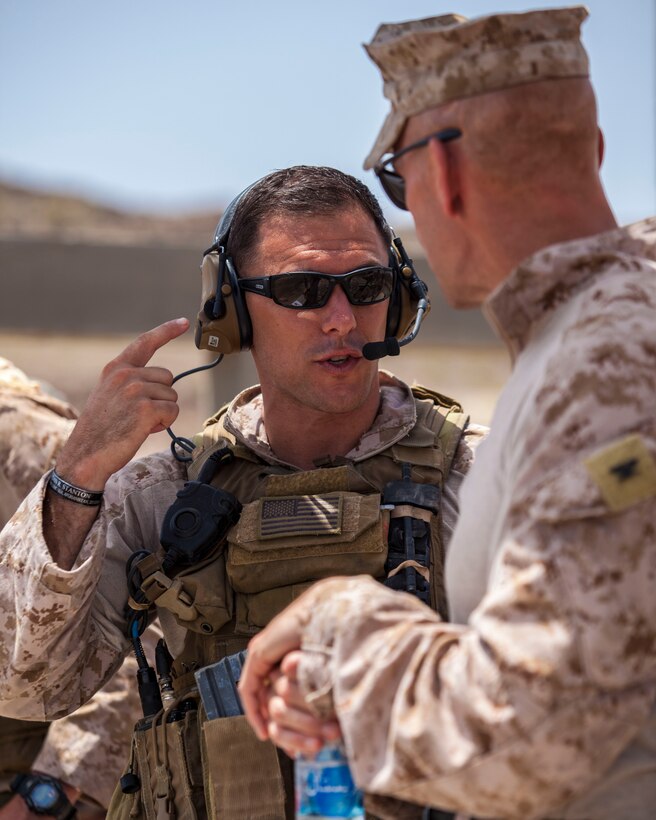 A 26th Marine Expeditionary Unit Maritime Raid Force Marine briefs Col. Matthew St. Clair, 26th MEU commanding officer, on the advantages of the Peltor Dual Communications Headset prior conducting a joint terminal attack control training exercise at an observation post in Djibouti, Africa, May 30, 2013. The 26th MEU is a Marine Air-Ground Task Force forward-deployed to the U.S. 5th Fleet area of responsibility aboard the Kearsarge Amphibious Ready Group serving as a sea-based, expeditionary crisis response force capable of conducting amphibious operations across the full range of military operations. (U.S. Marine Corps photo by Sgt. Christopher Q. Stone, 26th MEU Combat Camera/Released)