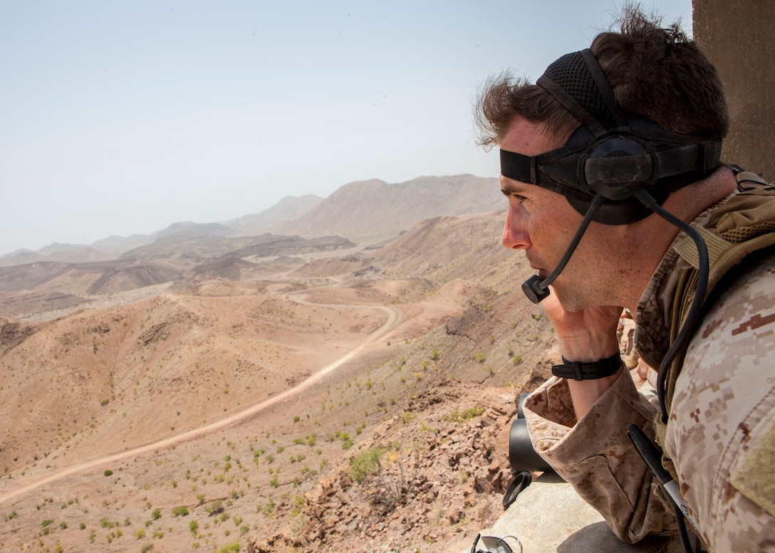 A 26th Marine Expeditionary Unit Maritime Raid Force Marine controls close air support with a French Mirage 2000D jet fighter while conducting a joint terminal attack control training exercise at an observation post in Djibouti, Africa, May 30, 2013. The 26th MEU is a Marine Air-Ground Task Force forward-deployed to the U.S. 5th Fleet area of responsibility aboard the Kearsarge Amphibious Ready Group serving as a sea-based, expeditionary crisis response force capable of conducting amphibious operations across the full range of military operations. (U.S. Marine Corps photo by Sgt. Christopher Q. Stone, 26th MEU Combat Camera/Released)