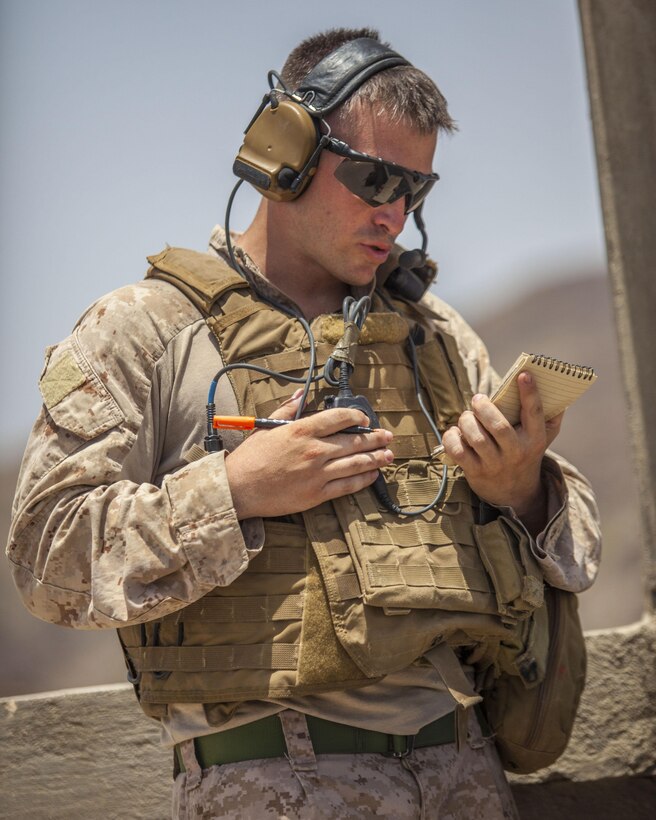 A 26th Marine Expeditionary Unit Maritime Raid Force Marine communicates a close air support brief to a French Mirage 2000D jet fighter while conducting a joint terminal attack control training exercise at an observation post in Djibouti, Africa, May 30, 2013. The 26th MEU is a Marine Air-Ground Task Force forward-deployed to the U.S. 5th Fleet area of responsibility aboard the Kearsarge Amphibious Ready Group serving as a sea-based, expeditionary crisis response force capable of conducting amphibious operations across the full range of military operations. (U.S. Marine Corps photo by Sgt. Christopher Q. Stone, 26th MEU Combat Camera/Released)