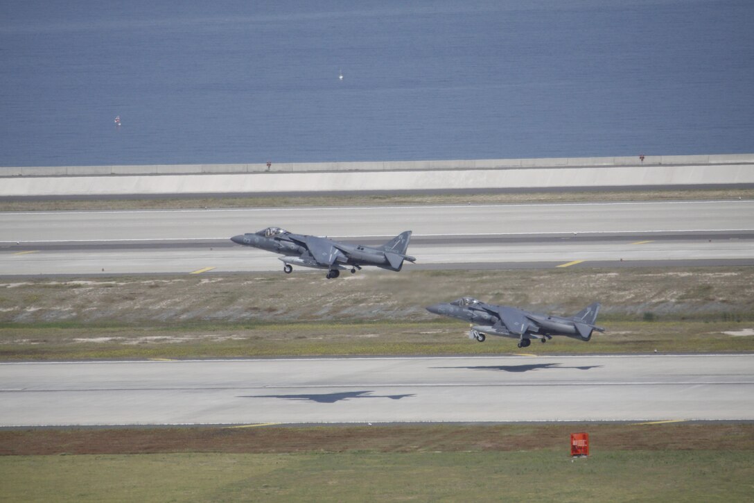 Two AV-8B Harrier II aircraft from Marine Attack Squadron 513 take off from Marine Corps Air Station Iwakuni, Japan, to Kadena Air Base, Okinawa, Japan, May 24, 2013. VMA-513 conducted their last flights before their deactivation July 13, 2013.
