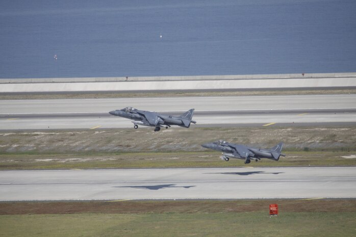Two AV-8B Harrier II aircraft from Marine Attack Squadron 513 take off from Marine Corps Air Station Iwakuni, Japan, to Kadena Air Base, Okinawa, Japan, May 24, 2013. VMA-513 conducted their last flights before their deactivation July 13, 2013.