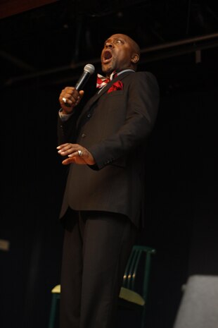 Tony Woods performs his routine during the Armed Forces Entertainment Celebrity Comedy Tour show, “Trippin’ with the Troops,” in the Club Iwakuni ballroom at Marine Corps Air Station Iwakuni, Japan, May 29, 2013. Woods was a former United States Navy corpsman, attached to Fleet Marine Force. Along with their performance, comedians Daniel Dugar, Mark Guillory and Tony Woods received a tour of the base. The tour consisted of a Provost Marshal's Office K-9 dog demonstration, a meet-and-greet with Marine Aviation Logistics Squadron 12 and a radio interview with American Forces Network.