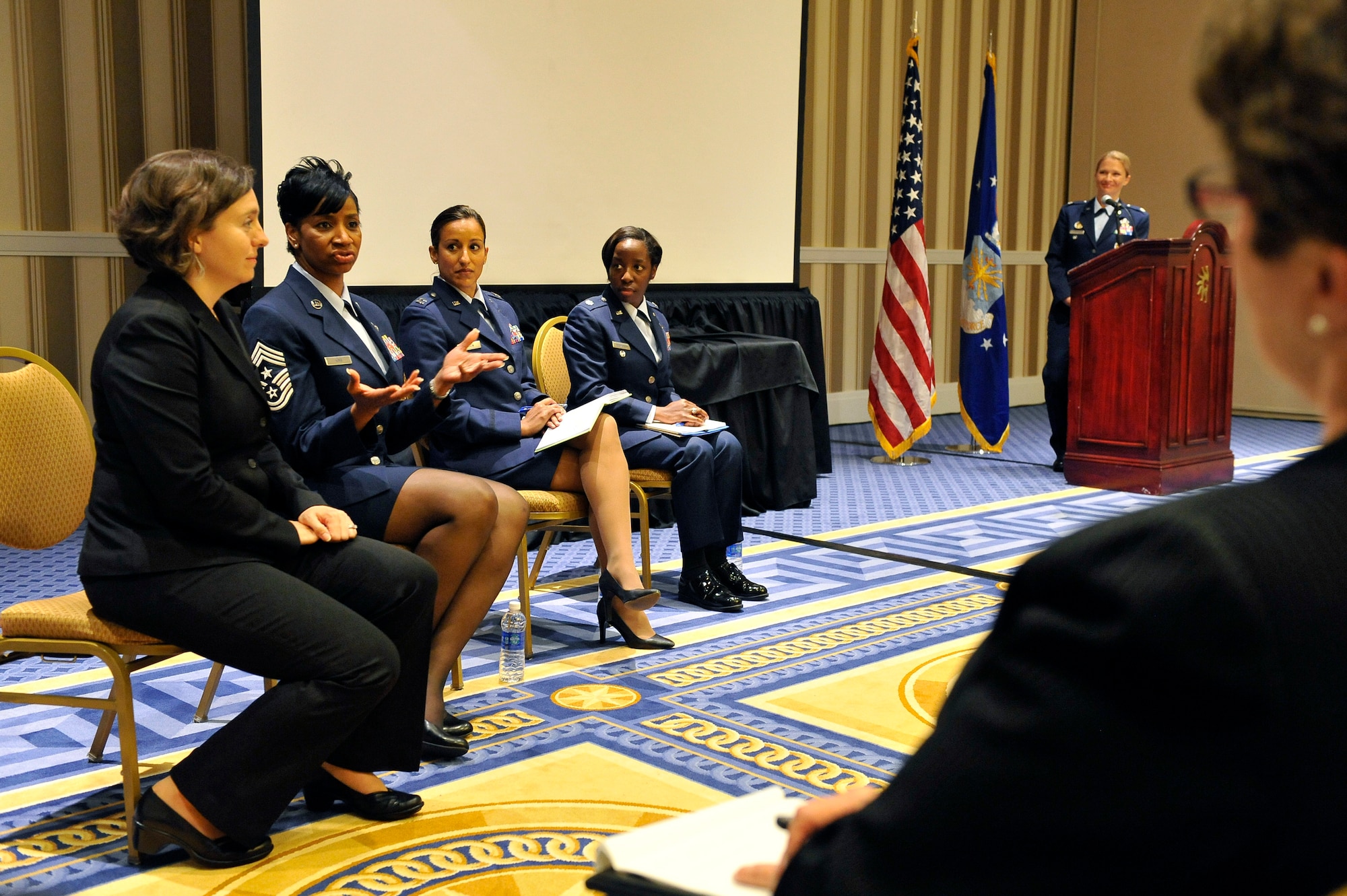 )Lt. Col. Tiaa Henderson, (left to right)  Capt. Amanda Mason, Chief Master Sgt. Trae King and Gail Lee participated in an Air Force panel discussion on why women are leaving the Air Force during the 2013 Joint Women's Leadership Symposium held in National Harbor, Md., June 7, 2013. (DoD photo/ Desiree N. Palacios)
