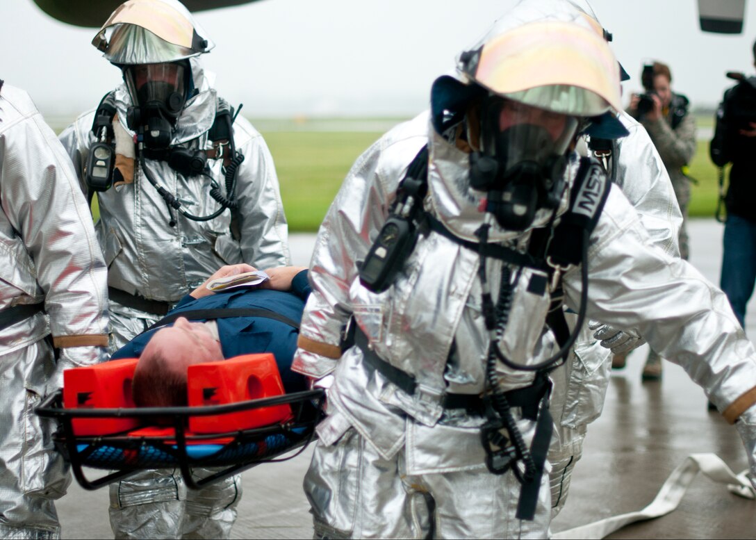 Members of the 914th and 107th Airlift Wings along with first responders from state and local agencies respond to a simulated plane crash during a Mass Accident Response Exercise at the Niagara Falls International Airport, June 8, 2013, Niagara Falls, N.Y. This exercise was designed to evaluate the capability of the Niagara Falls Air Reserve Station in responding to a hypothetical accident involving mass casualties and to evaluate the effectiveness its emergency response plan. (U.S. Air Force photo by Tech. Sgt. Joseph McKee) 
