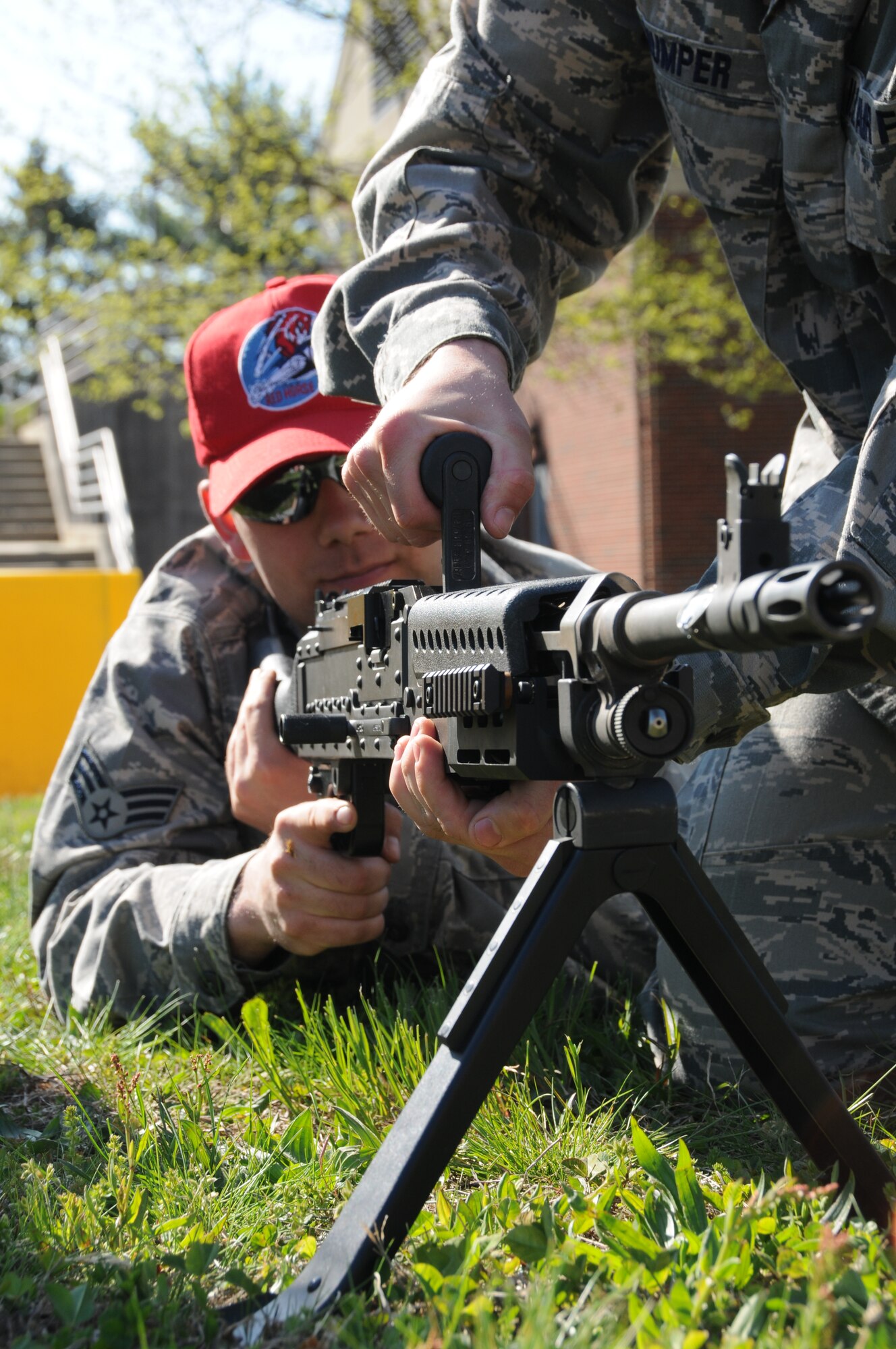 Members of the 201st RED HORSE Squadron, Detachment 1 team-up for the academic portion on the M-240 Bravo qualification course on May 3 at Horsham Air Guard Station, Pa. Senior Airman Ryan Pursell, firing, practice the barrel swap-out procedure with Staff Sgt. Michael Mumper. Recent regulation changes regarding specific weapons qualification training have increased the challenges that members will encounter. 