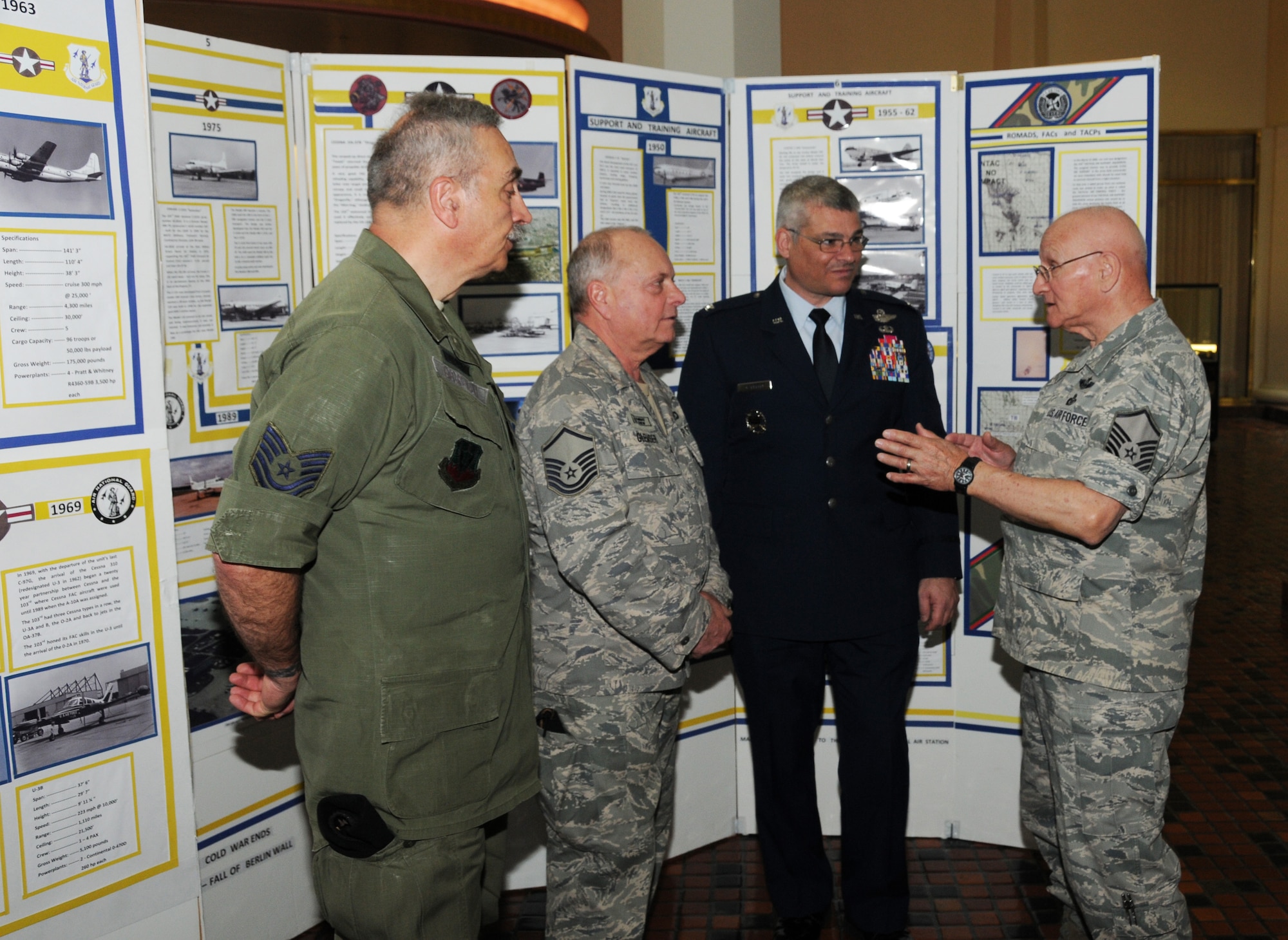 Members of the 111th Fighter Wing historical office participated in the annual Guard Day at the Capitol event held at the Pennsylvania state capitol building in Harrisburg, Pa. on April 17. The event attended by Pa. Air and Army Guard units from across the state, offers the opportunity to legislators and capitol visitors to learn about the diverse state and federal missions performed Pa. Guardsmen. Air Deputy Adjutant General, Col. Anthony Carrelli, right-center, talks 111th Fighter Wing history with retired Tech. Sgt. Rich Ciborowski , left, retired Master Sgt. Larry Glemser and retired Master Sgt. Jim Waibel.