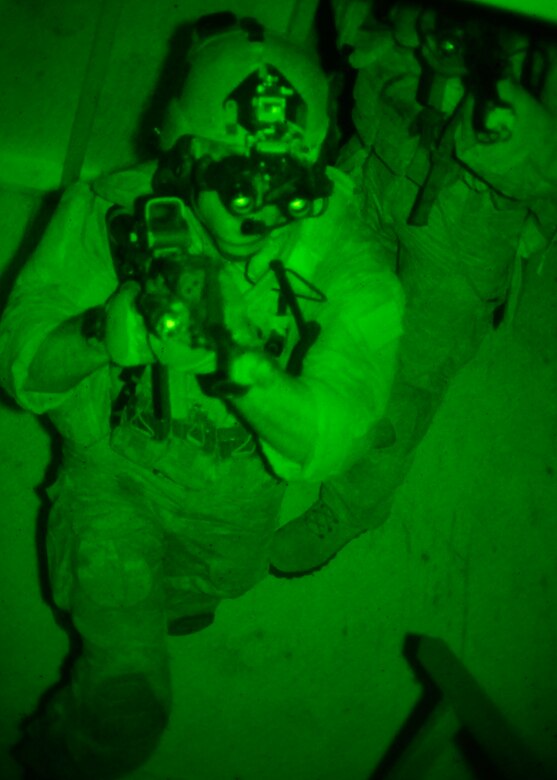 Students from the 23rd Special Tactics Training Squadron search a building for a high-value-target using night-vision goggles during an exercise on the Eglin Air Force Base range.  The exercise provided critical training in counter-insurgency tactics, land navigation and mission planning to potential Air Force combat controllers.  (U.S. Air Force photo/Tech. Sgt. Cheryl Foster)
