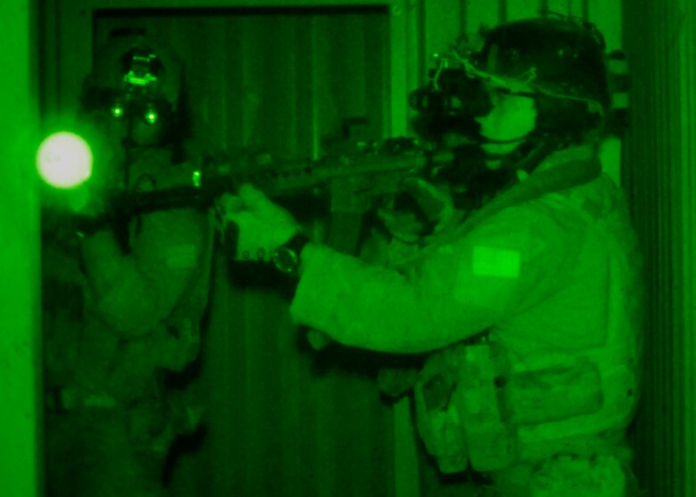 Students from the 23rd Special Tactics Training Squadron search a building for a high-value-target using night-vision goggles during an exercise on the Eglin Air Force Base range.  The exercise provided critical training in counter-insurgency tactics, land navigation and mission planning to potential Air Force combat controllers. (U.S. Air Force photo/Tech. Sgt. Cheryl Foster)