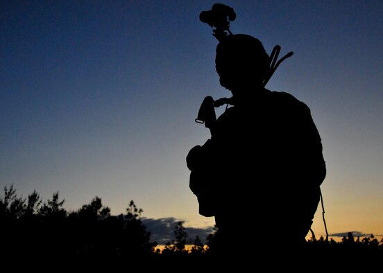 A 23rd Special Tactics Training Squadron student guards the perimeter in a counter-insurgency exercise on the Eglin Air Force Base range. The exercise provided critical training in counter-insurgency tactics, land navigation and mission planning to potential Air Force combat controllers.  (U.S. Air Force photo/Tech. Sgt. Cheryl Foster)