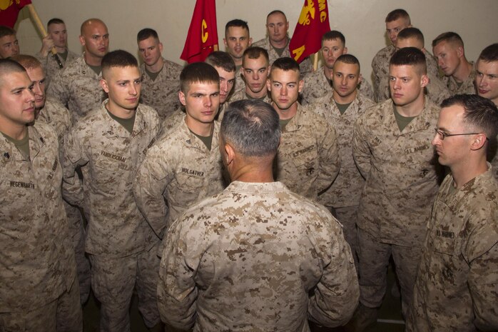 Commanding general for Force Headquarters Group, Marine Forces Reserve, Brig. Gen. Paul K. Lebidine talks with Marines from various military police organizations following 4th Law Enforcement Battalion's unit activation ceremony June 8. The unit officially reactivated Sept. 26, 2012. For additional imagery from the event, visit www.facebook.com/rstwincities.