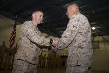 Brig. Gen. Paul K. Lebidine congratulates Maj. Timothy J. Humphreys for receiving the 2012 Jim Kallstrom Leadership Award during the 4th Law Enforcement Battalion activation ceremony June 8. According to Marine Administrative Message 640/12, Kallstrom Award nominees "must set the standard for all Marines to follow and exhibit qualities that have made an outstanding contribution to the development of esprit de corps, loyalty, and mission accomplishment within their unit." For additional imagery from the event, visit www.facebook.com/rstwincities.