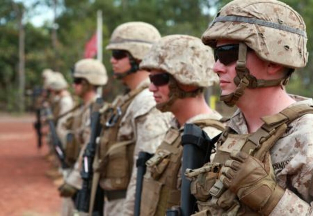 Lance Cpl. Aaron Ridlen, 3rd Platoon, Lima Company, 3rd Battalion, 3rd Marine Regiment, Marine Rotational Force – Darwin, waits his turn to fire during a poker-shoot competition, here, May 16. The rules of poker applied to the shoot, and the team who shot the best hand advanced to the next round.
